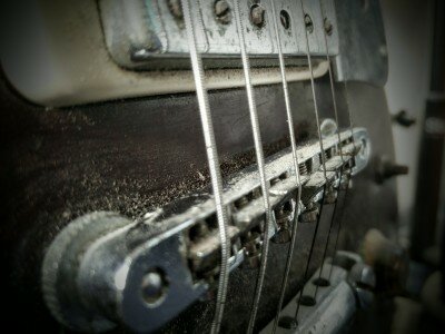 how to adjust intonation on the guitar